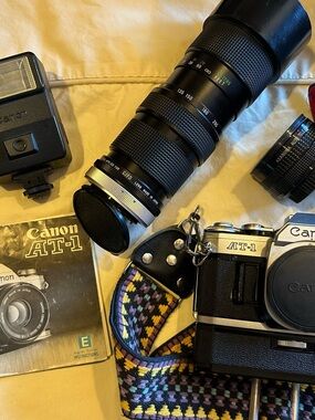 Canon AT-1 35mm SLR Camera with Black Body and Multicolor Woven Strap